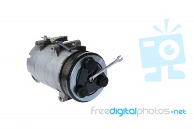 Car Air Compressor And  Wrench On A White Background Stock Photo