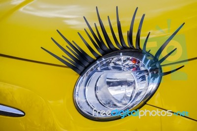 Car Headlight Complete With Eyelashes Stock Photo