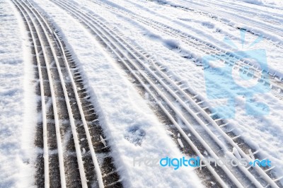 Car Tire Tracks In Snow Stock Photo