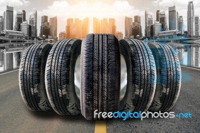 Car Tires In Row On The Street Stock Photo