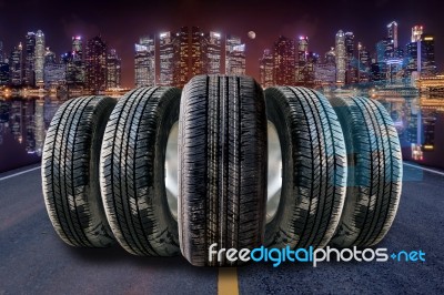 Car Tires In Row On The Street Stock Photo