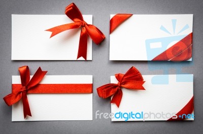 Card With Red Ribbons Bows Stock Photo