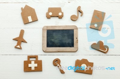 Cardboard Web Icons And An Old Blackboard On White Background Stock Photo