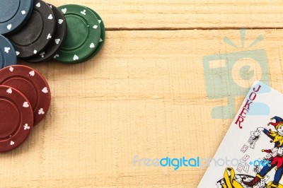 Cards And Poker Chips On Wooden Background Stock Photo