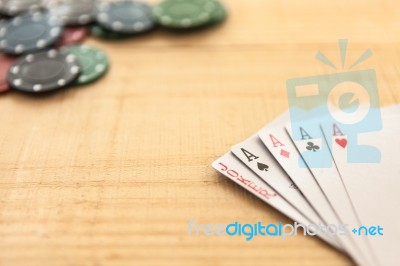 Cards And Poker Chips On Wooden Background Stock Photo