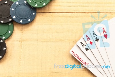 Cards And Poker Chips On Wooden Background Stock Photo