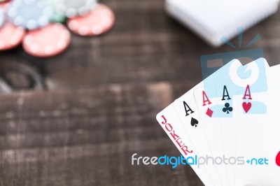 Cards And Poker Chips On Wooden Background Stock Photo