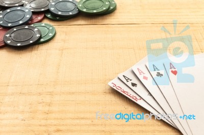 Cards And Poker Chips On Wooden Background Stock Photo