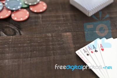 Cards And Poker Chips On Wooden Background Stock Photo