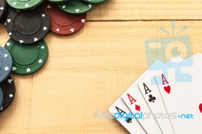 Cards And Poker Chips On Wooden Background Stock Photo