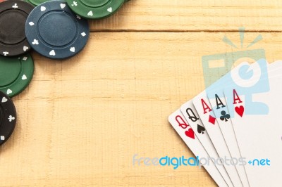 Cards And Poker Chips On Wooden Background Stock Photo