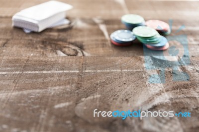 Cards And Poker Chips On Wooden Background Stock Photo