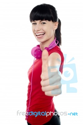 Carefree Teenager Flashing Thumbs Up Sign Stock Photo