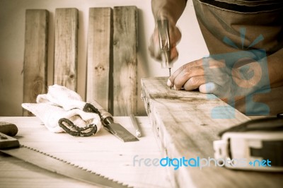 Carpenter Hammer A Nail, Vintage Style Stock Photo