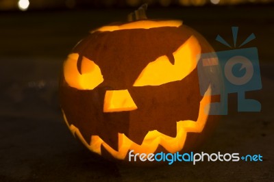 Carved Lit Halloween Pumpkin Stock Photo