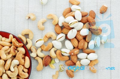 Cashew Nut And Almonds On Tablecloth Stock Photo