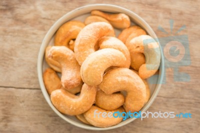 Cashew Nut Roast Salt On Weathered Wooden Table Stock Photo