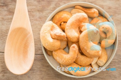 Cashew Nut Roast Salt On Weathered Wooden Table Stock Photo