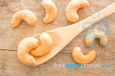 Cashew Nut Roast Salt On Weathered Wooden Table Stock Photo