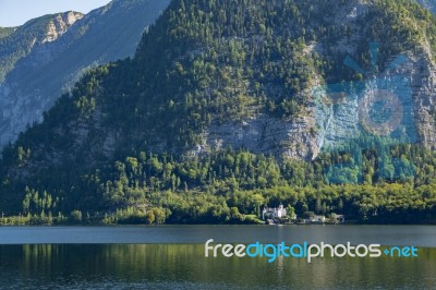 Castle Schloss On The Shoreline Of Lake Hallstatt Stock Photo