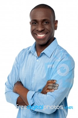 Casual African Man With Arms Crossed Stock Photo