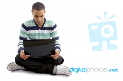 Casual Boy Sitting With Notebook Stock Photo