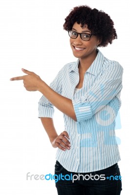 Casual Business Lady Indicating Sideways Stock Photo