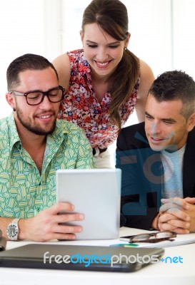 Casual Executives Working Together At A Meeting With Digital Tab… Stock Photo