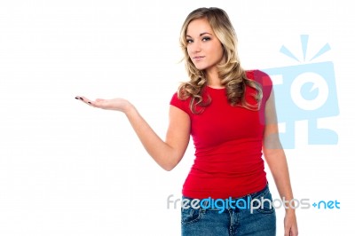 Casual Girl Presenting Something Stock Photo