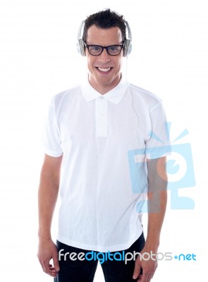 Casual Guy Enjoying Music Stock Photo