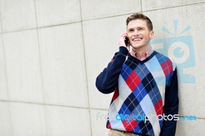 Casual Guy Talking On A Cell Phone Stock Photo