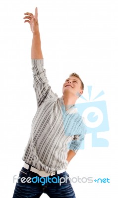 Casual Male Pointing Upward Stock Photo