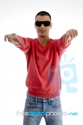 Casual Male Pointing With Both Hands Stock Photo