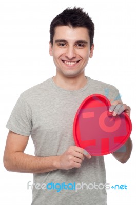 Casual Man Holding Heart Stock Photo