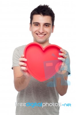 Casual Man Holding Heart Stock Photo