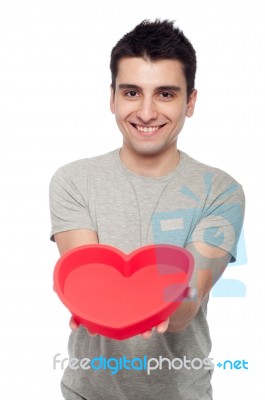 Casual Man Holding Heart Stock Photo