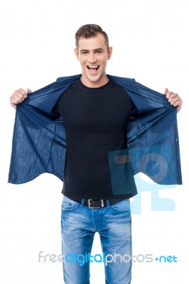 Casual Man Opening His Shirt Stock Photo