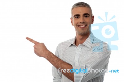 Casual Man Showing Something Stock Photo