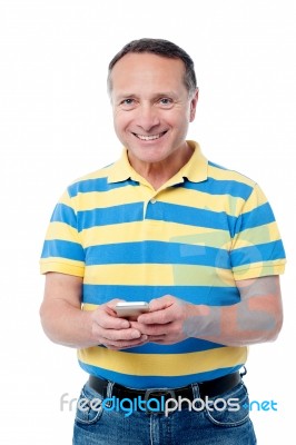 Casual Man Using  Mobile Phone Stock Photo