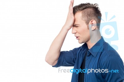 Casual Man With Hand On Head Stock Photo