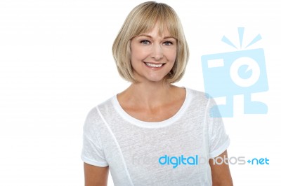 Casual Portrait Of Smiling Middle Aged Woman Stock Photo