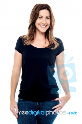 Casual Pose Of Middle Aged Woman Stock Photo