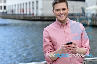 Casual Pose Of Smiling Man At Outdoors Stock Photo