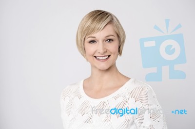 Casual Pose Of Smiling Middle Aged Woman Stock Photo