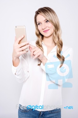 Casual Pretty Woman Taking A Selfie Stock Photo