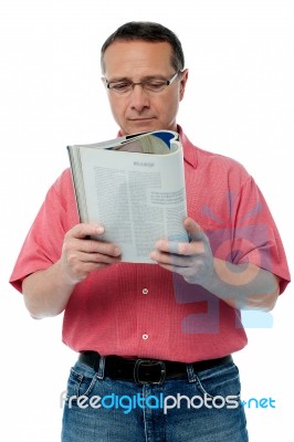 Casual Senior Man Reading A Book Stock Photo