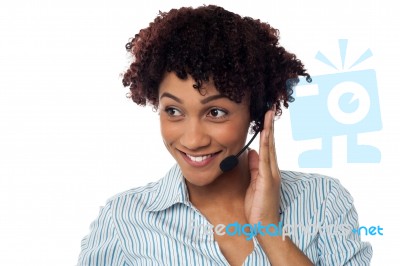 Casual Shot Of A Call Centre Executive Looking Away Stock Photo