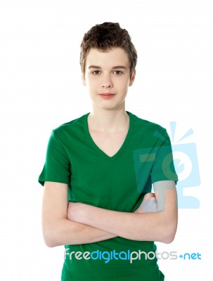 Casual Smart Boy Posing With His Arms Crossed Stock Photo