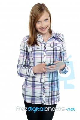 Casual Teen Girl Messaging Her Friends Stock Photo