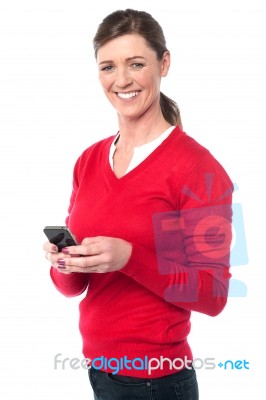 Casual  Woman Using Her Smart Phone Stock Photo